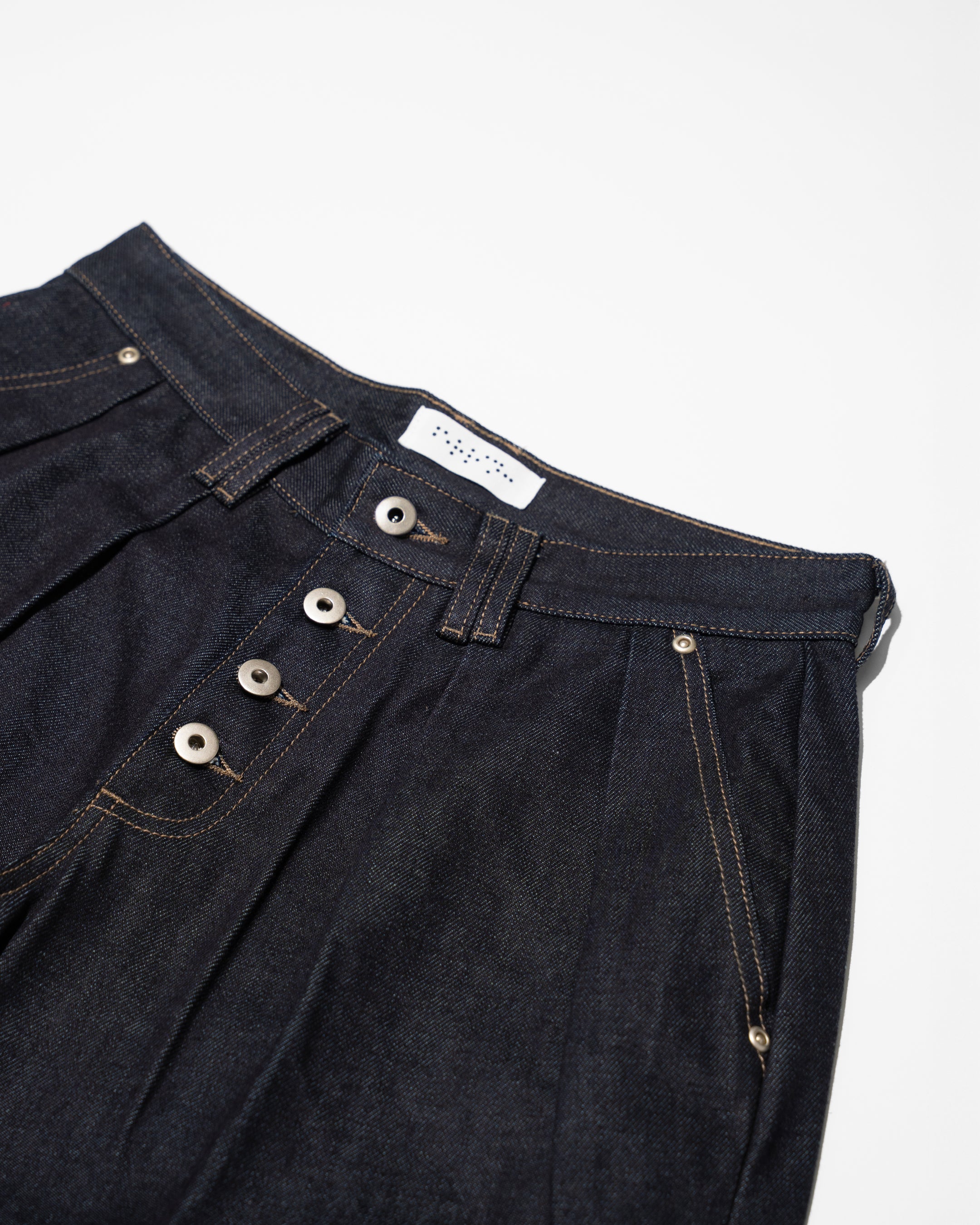 PLEATED RAW INDIGO JORTS